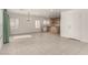 Open layout living room and kitchen area, featuring tiled floors and ample lighting at 519 Brinkburn Point Ave, Las Vegas, NV 89178