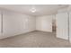 Spacious bedroom with plush carpeting, shuttered windows, and an ensuite bathroom at 519 Brinkburn Point Ave, Las Vegas, NV 89178