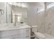 Bright bathroom featuring a modern vanity, marble countertop, and walk-in shower at 5251 Graystone, Pahrump, NV 89061