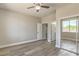 Neutral bedroom with hard surface floors, ceiling fan and doorways to the bathroom and closet at 5251 Graystone, Pahrump, NV 89061