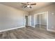 Spacious bedroom with neutral walls, wood-look floors and a closet with mirror doors at 5251 Graystone, Pahrump, NV 89061