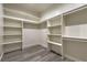 Walk-in closet featuring built-in shelving units with hanging rods at 5251 Graystone, Pahrump, NV 89061