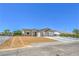 Beautiful single story home with a three-car garage and low-maintenance desert landscaping at 5251 Graystone, Pahrump, NV 89061