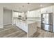 Bright kitchen featuring an oversized island, stainless steel appliances, and ample cabinet space at 5251 Graystone, Pahrump, NV 89061