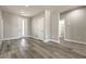 Neutral color scheme and wood-look floors throughout an open-concept living area with bright natural light at 5251 Graystone, Pahrump, NV 89061