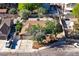 Aerial shot showcases a tree-filled yard, mature landscaping, and neighborhood surroundings at 5772 Arbor Oak Cir, Las Vegas, NV 89142