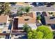 Aerial view of the home with a tree-covered backyard and detached storage shed at 5772 Arbor Oak Cir, Las Vegas, NV 89142