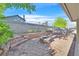 A spacious backyard featuring tiered landscaping with stone and brick accents at 5772 Arbor Oak Cir, Las Vegas, NV 89142