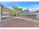Spacious backyard features a covered patio and gravel area with cinder block wall at 5772 Arbor Oak Cir, Las Vegas, NV 89142