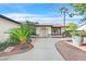 Home with unique architectural features, including an arched entryway and modern driveway at 5772 Arbor Oak Cir, Las Vegas, NV 89142