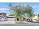 Charming single-story home featuring a two-car garage and mature landscaping with shade trees at 5772 Arbor Oak Cir, Las Vegas, NV 89142