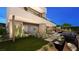 Backyard featuring a manicured lawn, a pool, and modern patio furniture at 607 Grand Rim Dr, Henderson, NV 89012