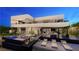 Luxury home featuring an outdoor living area, a pool, and comfortable lounge chairs at 607 Grand Rim Dr, Henderson, NV 89012