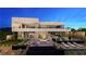 Luxury home featuring an outdoor living area, a pool, and comfortable lounge chairs at 607 Grand Rim Dr, Henderson, NV 89012