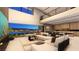 Open-concept living area featuring a sofa, modern decor, and city views at 607 Grand Rim Dr, Henderson, NV 89012