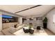 Open concept living area with stylish decor, sofa and seamless kitchen access at 607 Grand Rim Dr, Henderson, NV 89012