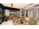 Contemporary living area with sleek furniture and city view through large windows at 607 Grand Rim Dr, Henderson, NV 89012