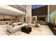 Spacious living room with high ceilings, contemporary decor, and seamless flow to the outdoor patio at 607 Grand Rim Dr, Henderson, NV 89012