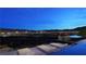 Relaxing poolside view features the city skyline and a mountain backdrop at 607 Grand Rim Dr, Henderson, NV 89012