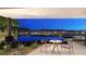 Outdoor patio view boasts a swimming pool and city skyline at 607 Grand Rim Dr, Henderson, NV 89012