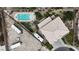 Aerial view of a house with a pool, RV parking and tile roof in a well-maintained community at 6116 Camas Canyon Ave, Las Vegas, NV 89130