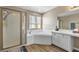 Bathroom featuring a soaking tub, glass enclosed shower, and vanity at 6116 Camas Canyon Ave, Las Vegas, NV 89130