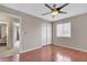 Bedroom with hardwood floors, a ceiling fan, and a closet with sliding doors, is ready to move in at 6116 Camas Canyon Ave, Las Vegas, NV 89130