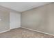 This bedroom includes carpeted floors and a closet with sliding doors, perfect for storage at 6116 Camas Canyon Ave, Las Vegas, NV 89130