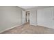 Carpeted bedroom with an open doorway and closet featuring sliding doors, offers convenience at 6116 Camas Canyon Ave, Las Vegas, NV 89130
