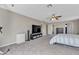 Bedroom featuring a large television and ensuite bathroom at 6116 Camas Canyon Ave, Las Vegas, NV 89130