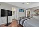 Bedroom featuring hardwood floors and ensuite bathroom at 6116 Camas Canyon Ave, Las Vegas, NV 89130