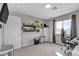 Bedroom featuring neutral walls, carpet, and a large window, offers flexibility in decor at 6116 Camas Canyon Ave, Las Vegas, NV 89130