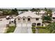 Charming two-story home featuring a three-car garage, tile roof, and well-maintained landscaping at 6116 Camas Canyon Ave, Las Vegas, NV 89130