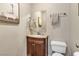 Charming half bath with vanity, mirror, and modern fixtures at 6116 Camas Canyon Ave, Las Vegas, NV 89130