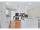 Bright kitchen with stainless steel appliances, white cabinetry, and breakfast bar at 6116 Camas Canyon Ave, Las Vegas, NV 89130