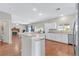 Well-lit kitchen with stainless steel appliances, white cabinets, and an open concept layout at 6116 Camas Canyon Ave, Las Vegas, NV 89130