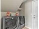 Functional laundry room with side-by-side washer and dryer at 6116 Camas Canyon Ave, Las Vegas, NV 89130