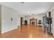 Spacious living room featuring a fireplace, hardwood floors, a ceiling fan and ample natural light at 6116 Camas Canyon Ave, Las Vegas, NV 89130