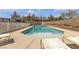 Beautiful backyard pool with a spacious deck and lounge chairs at 6116 Camas Canyon Ave, Las Vegas, NV 89130