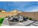 Stylish backyard with modern patio furniture and sleek, contemporary design, perfect for entertaining at 6544 Sandero Springs St, Las Vegas, NV 89166