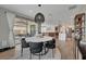 Open-concept dining area that connects to the kitchen, living room, and outdoor patio space at 6544 Sandero Springs St, Las Vegas, NV 89166