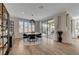 Elegant dining area featuring modern lighting, stylish furnishings, and sliding glass doors to an outdoor space at 6544 Sandero Springs St, Las Vegas, NV 89166