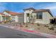 Charming single-story home with a well-maintained front yard, two-car garage and desert landscaping at 6544 Sandero Springs St, Las Vegas, NV 89166