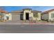 Charming single-story home with a well-maintained front yard and an attached two-car garage at 6544 Sandero Springs St, Las Vegas, NV 89166