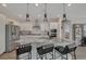 Beautiful kitchen featuring a spacious island, granite countertops, modern appliances, and stylish pendant lighting at 6544 Sandero Springs St, Las Vegas, NV 89166