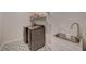 Laundry room featuring modern washer and dryer, plus sink and storage at 6544 Sandero Springs St, Las Vegas, NV 89166