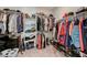 Walk-in closet with built-in shelving and racks for ample clothing and shoe storage at 6544 Sandero Springs St, Las Vegas, NV 89166