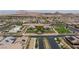 Community aerial view featuring mountain backdrop, lush landscaping, and amenities at 713 Webber Park St, Henderson, NV 89011