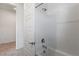 Clean bathroom with white tiled shower and tub, along with modern fixtures at 713 Webber Park St, Henderson, NV 89011
