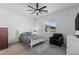 Comfortable bedroom with a ceiling fan, large window, and furniture at 713 Webber Park St, Henderson, NV 89011